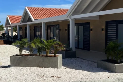 Panoramic view from a private waterfront deck directly overlooking the turquoise sea at our bonaire rentals on the water