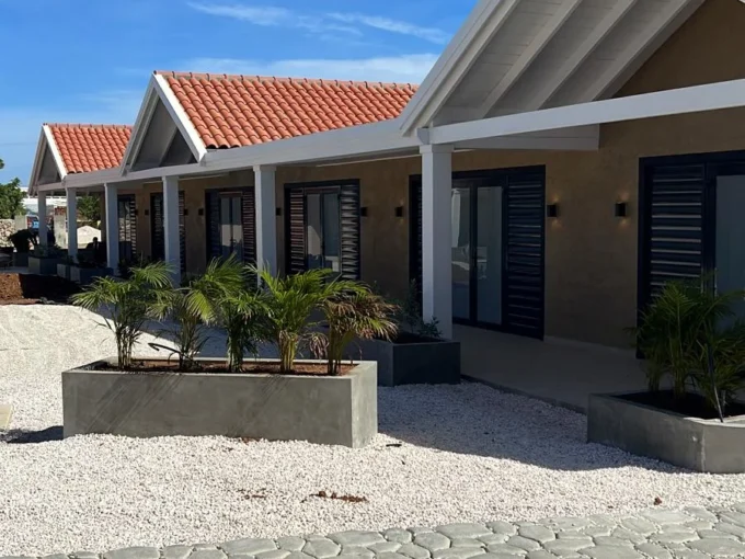 Panoramic view from a private waterfront deck directly overlooking the turquoise sea at our bonaire rentals on the water